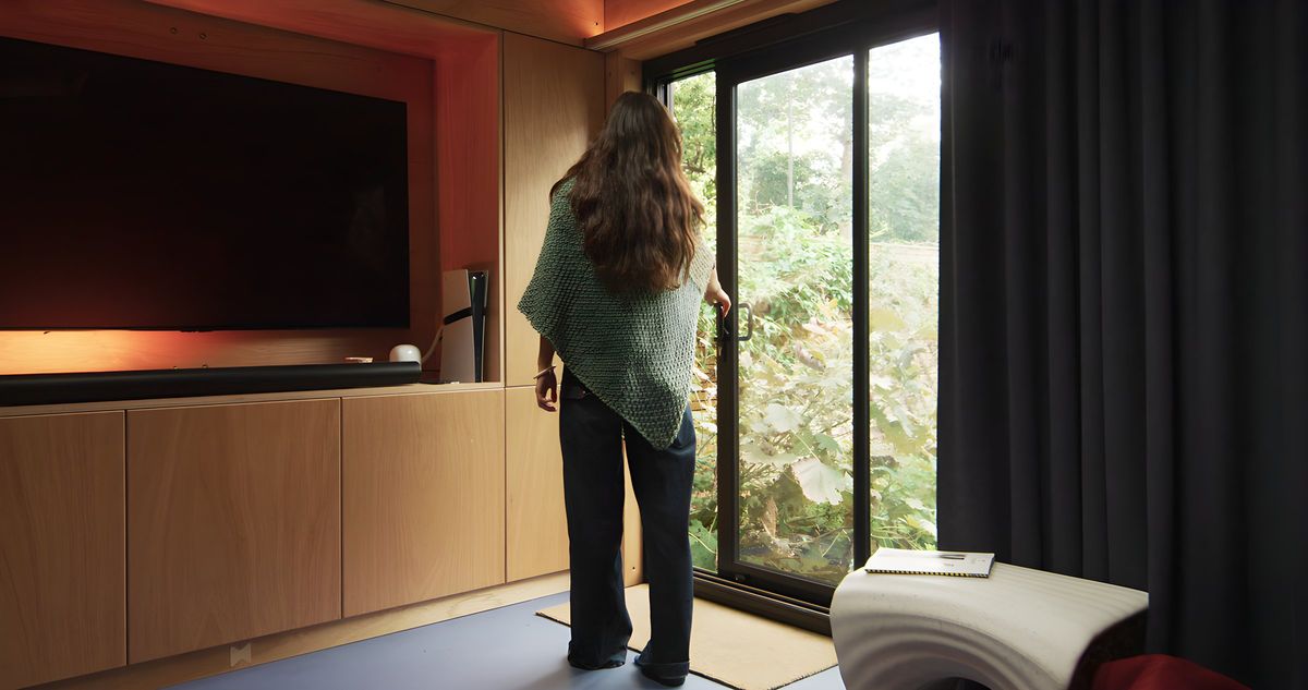 Bespoke TV cabinet with backlit recess, door to the garden