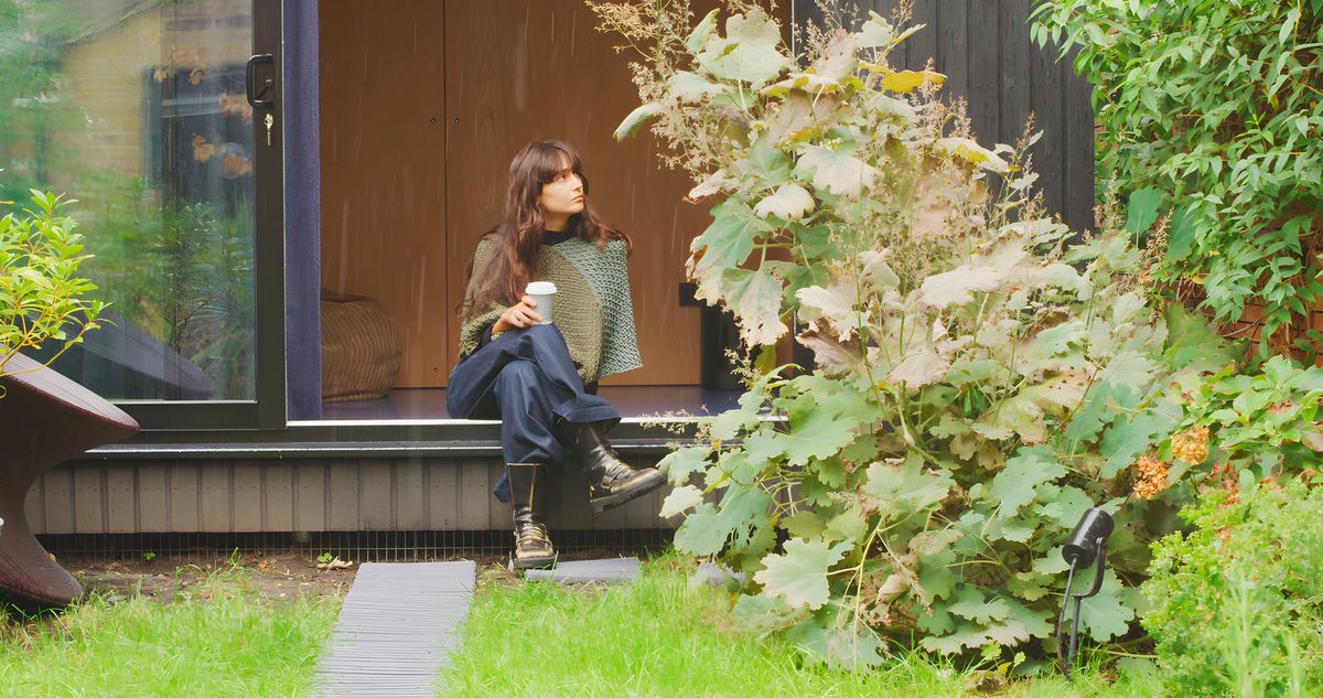 Sitting on the door sill with a coffee, planting alongside