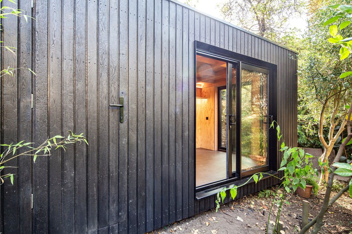 Side elevation: the storage door is flush in the cladding, by the sliding door