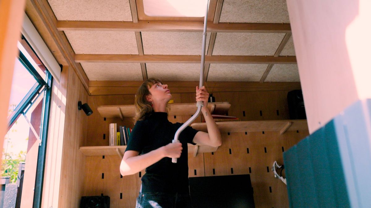 Opening the skylight with its pole in the music studio