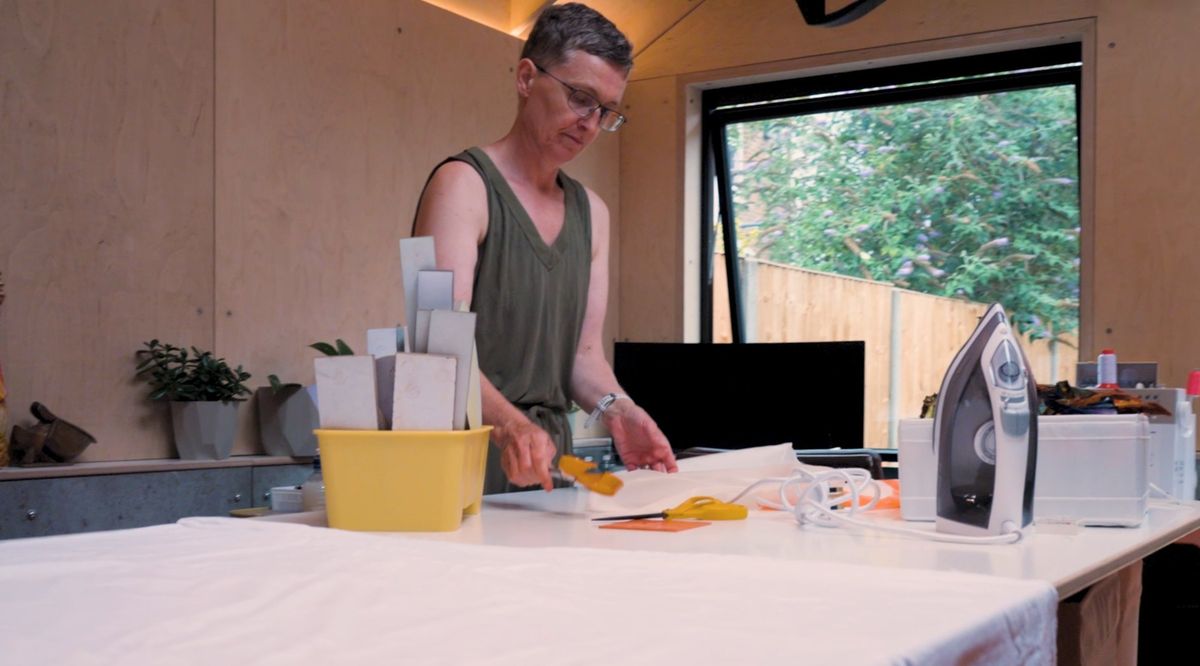 Cutting fabric at the big work table