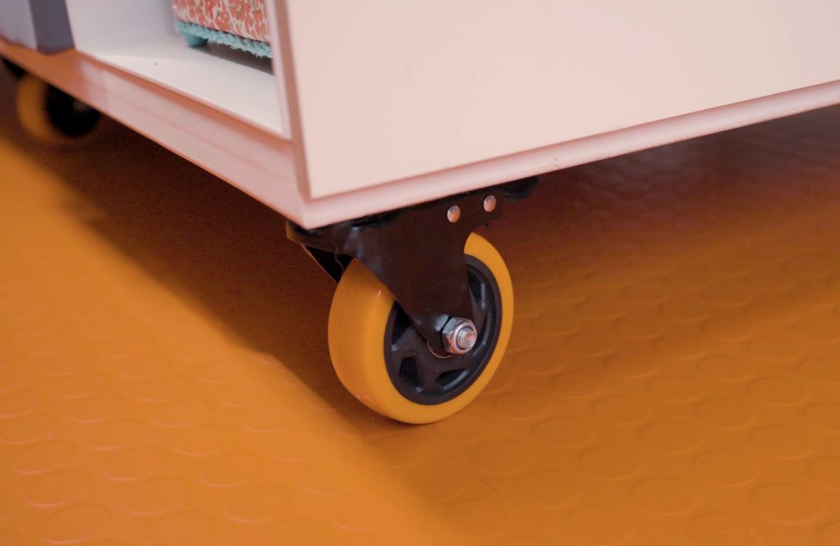 Work table on castors over the orange floor