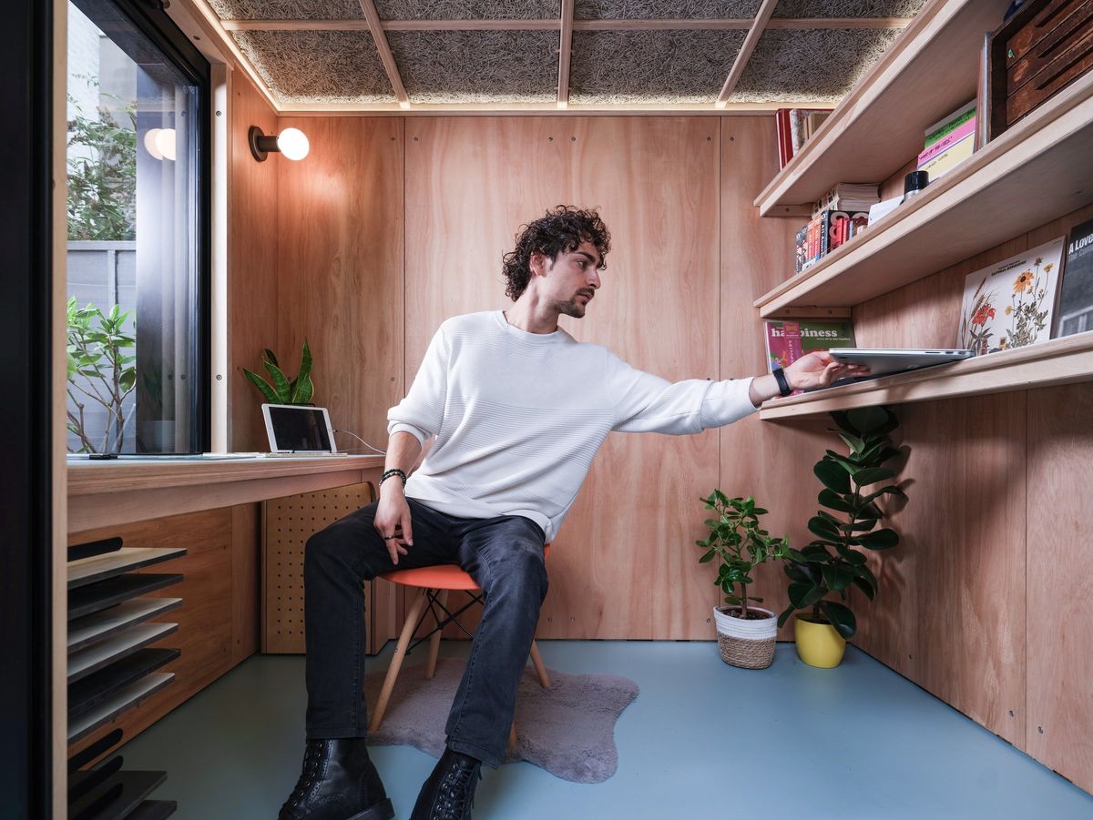 Reaching for the shelf from the chair: desk and shelving within reach