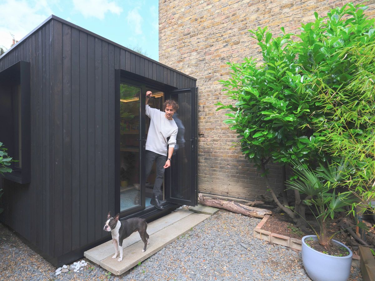 Owner at the door with the dog on the step