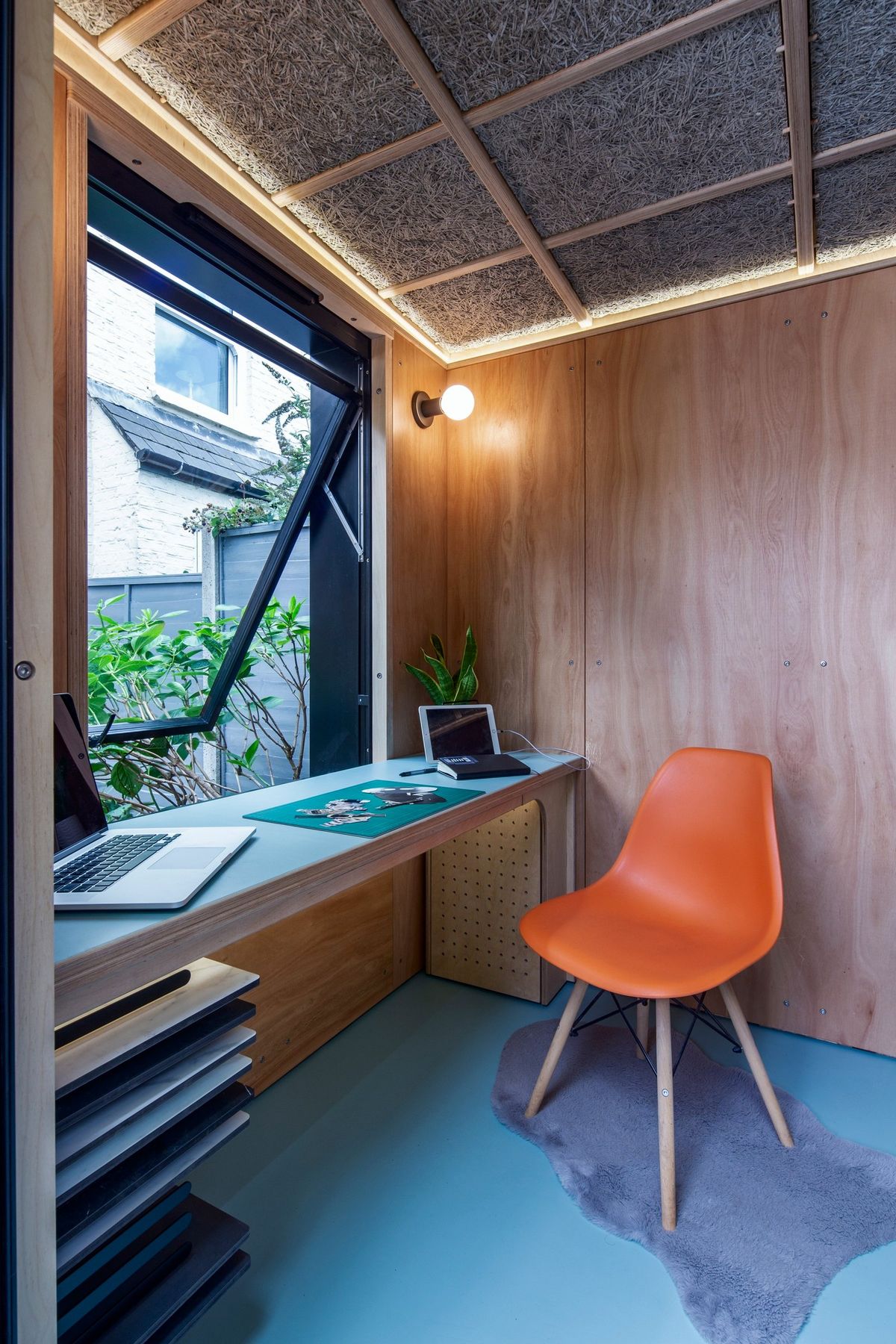 Window open over the desk, plan drawers below