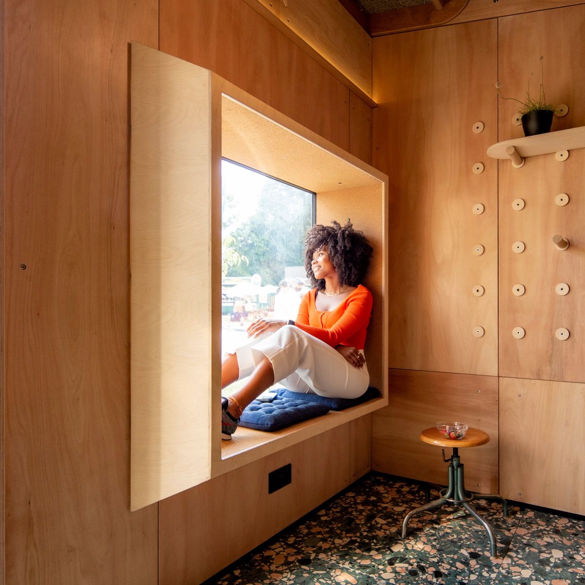 Woman reading in the deep window seat