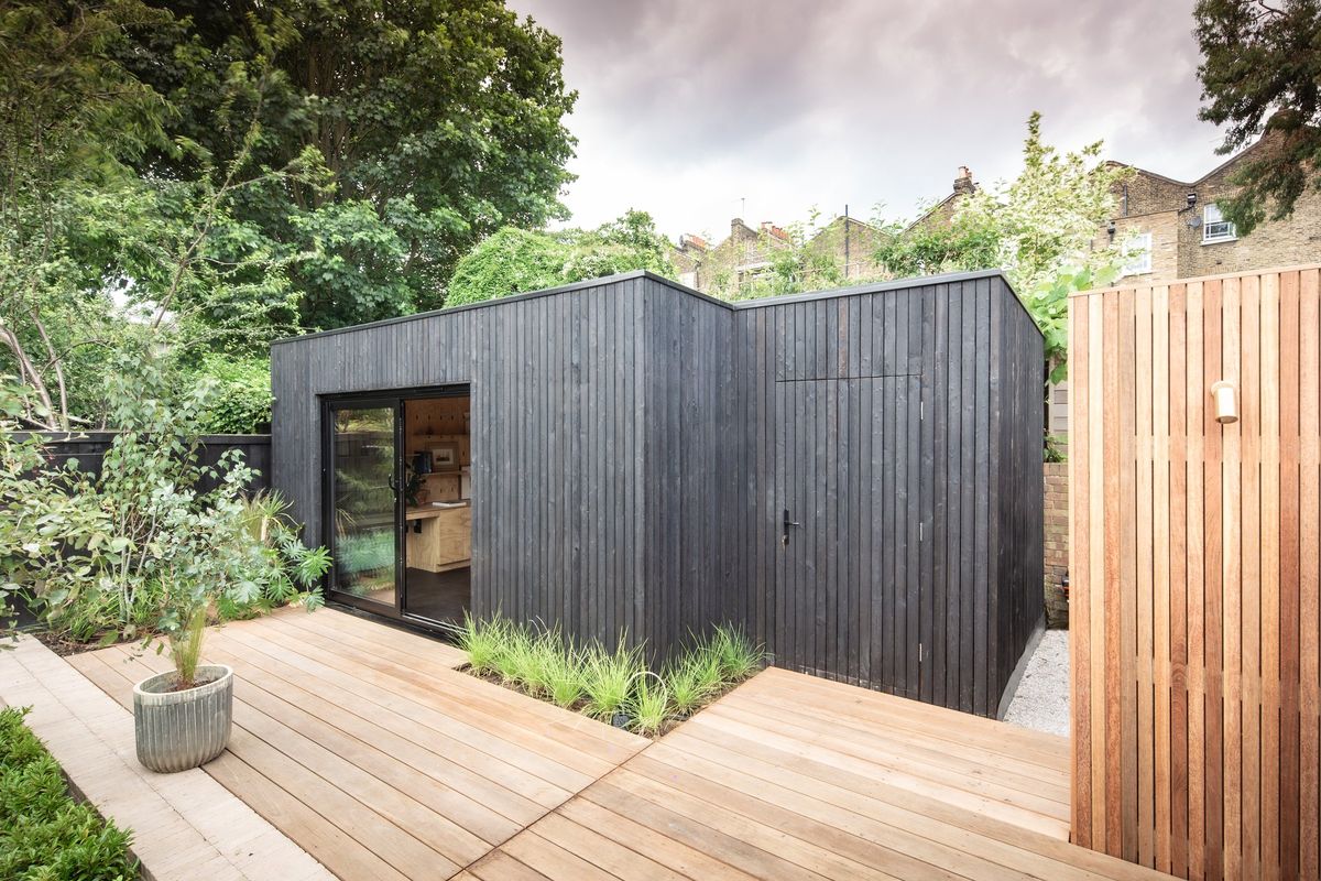 The two wings of the L-shaped studio seen from the timber deck