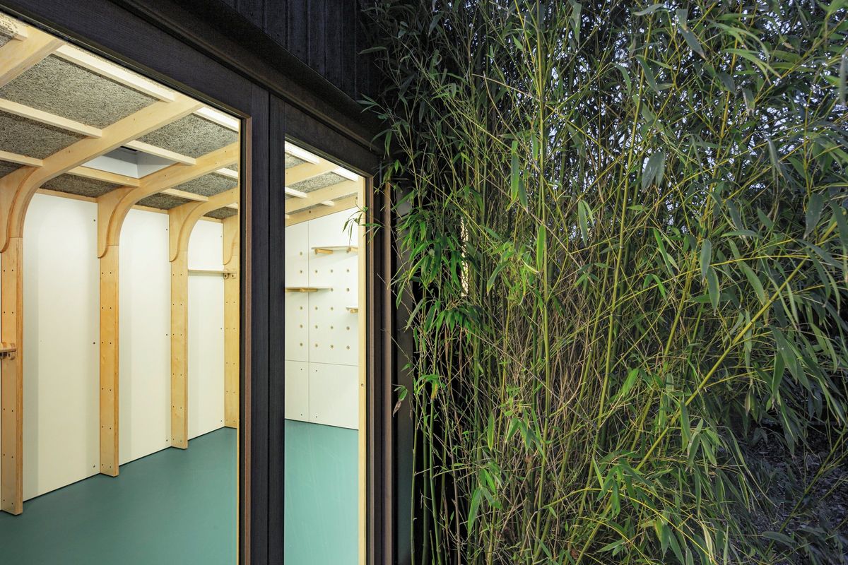 Arched frames seen through the doors, bamboo beside