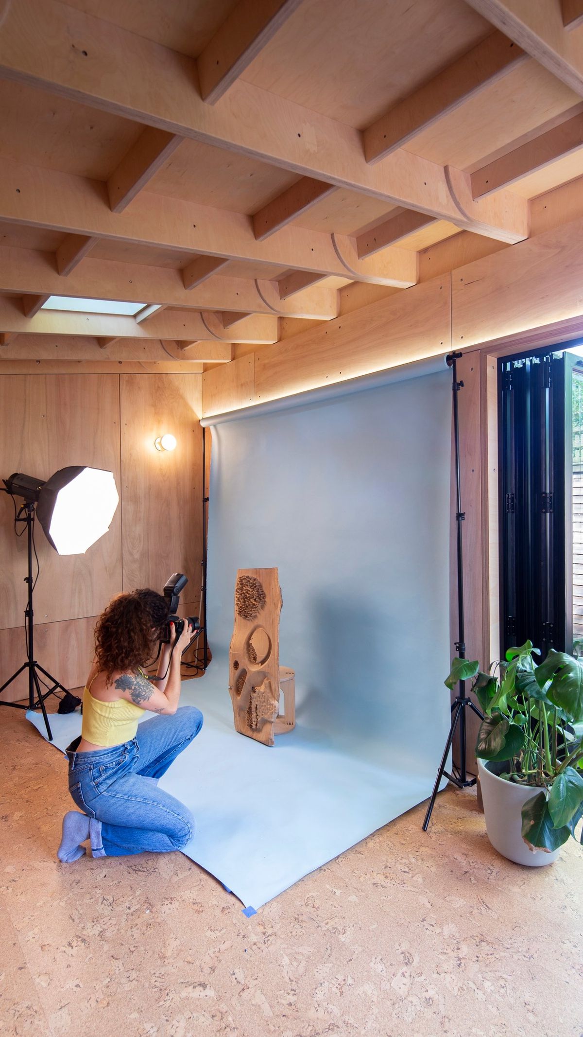 Photo shoot under the skylight, backdrop lit by the LED strip under the roof