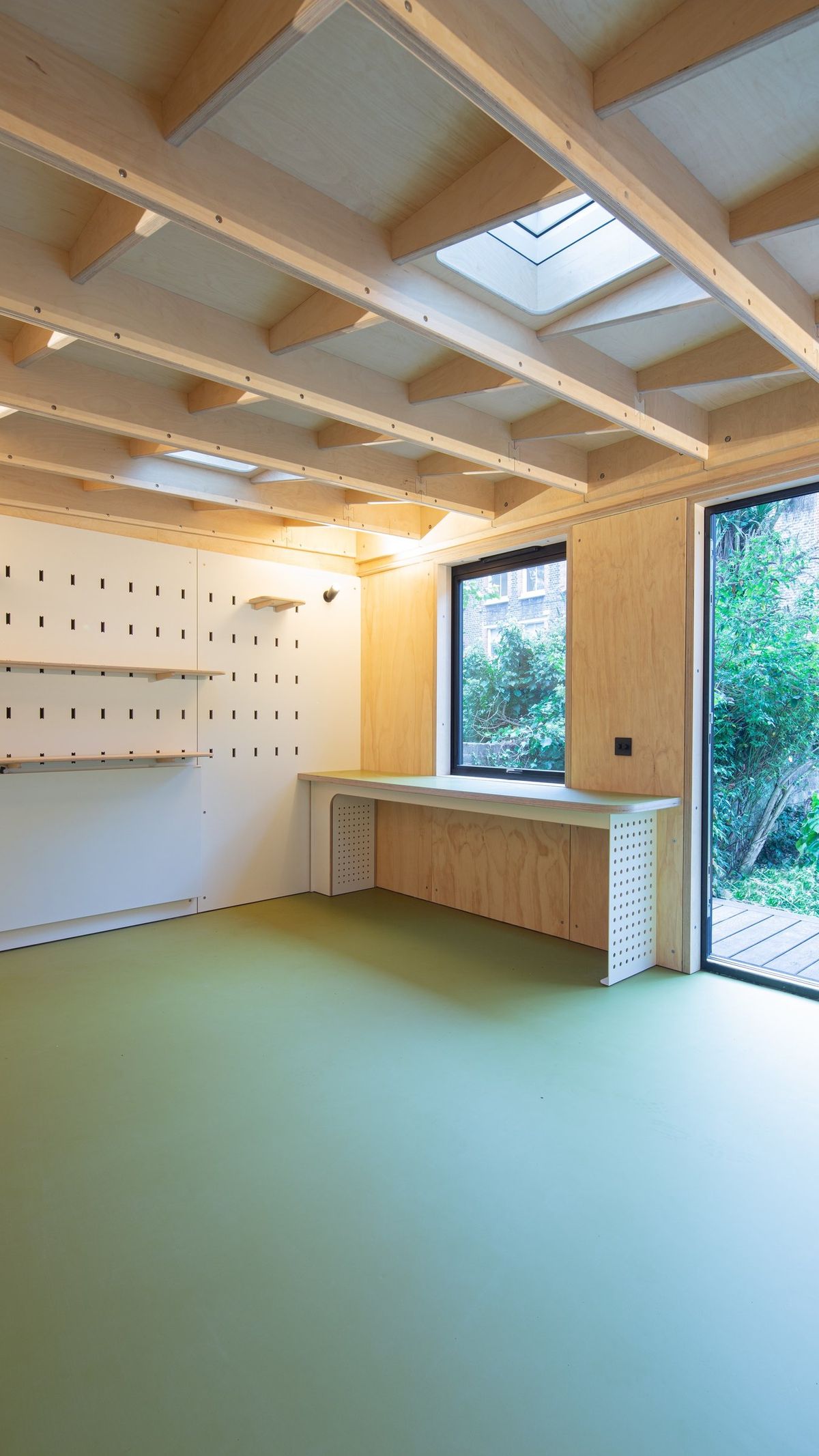 Desk by the window and doors to the garden