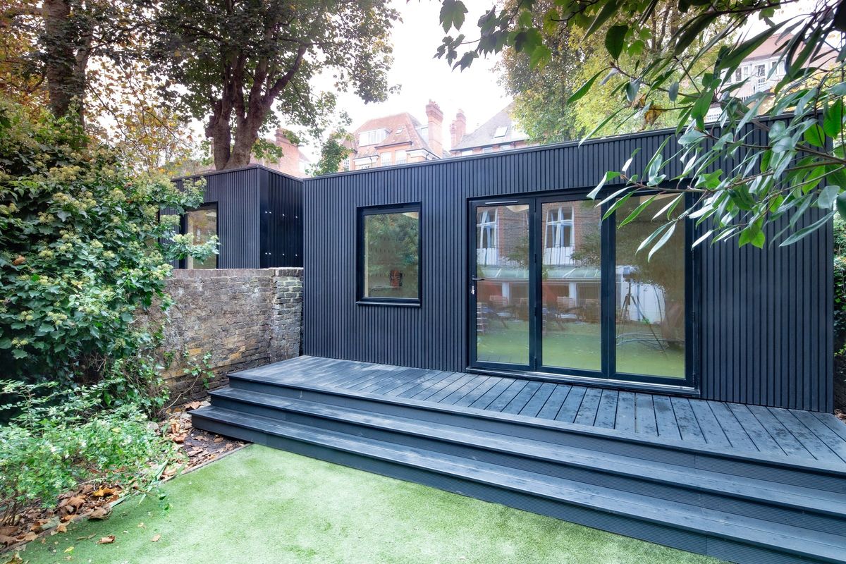 Both black garden rooms, the deck and steps up from the lawn