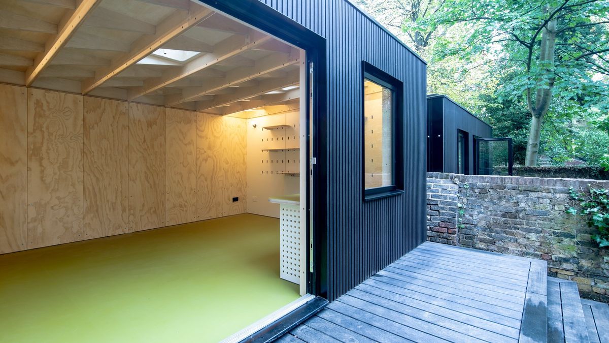 Bifolds open onto the deck, plywood interior