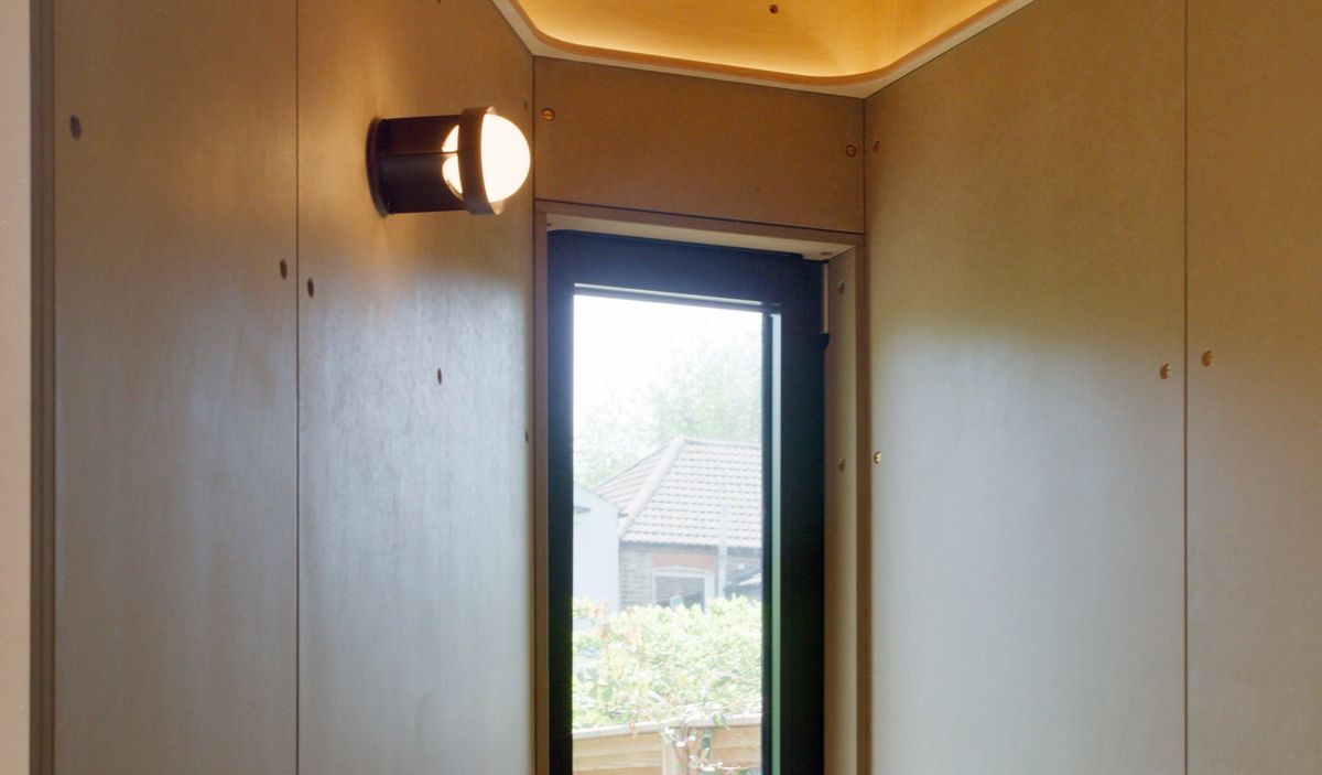 Valchromat walls and a glazed door out to the garden