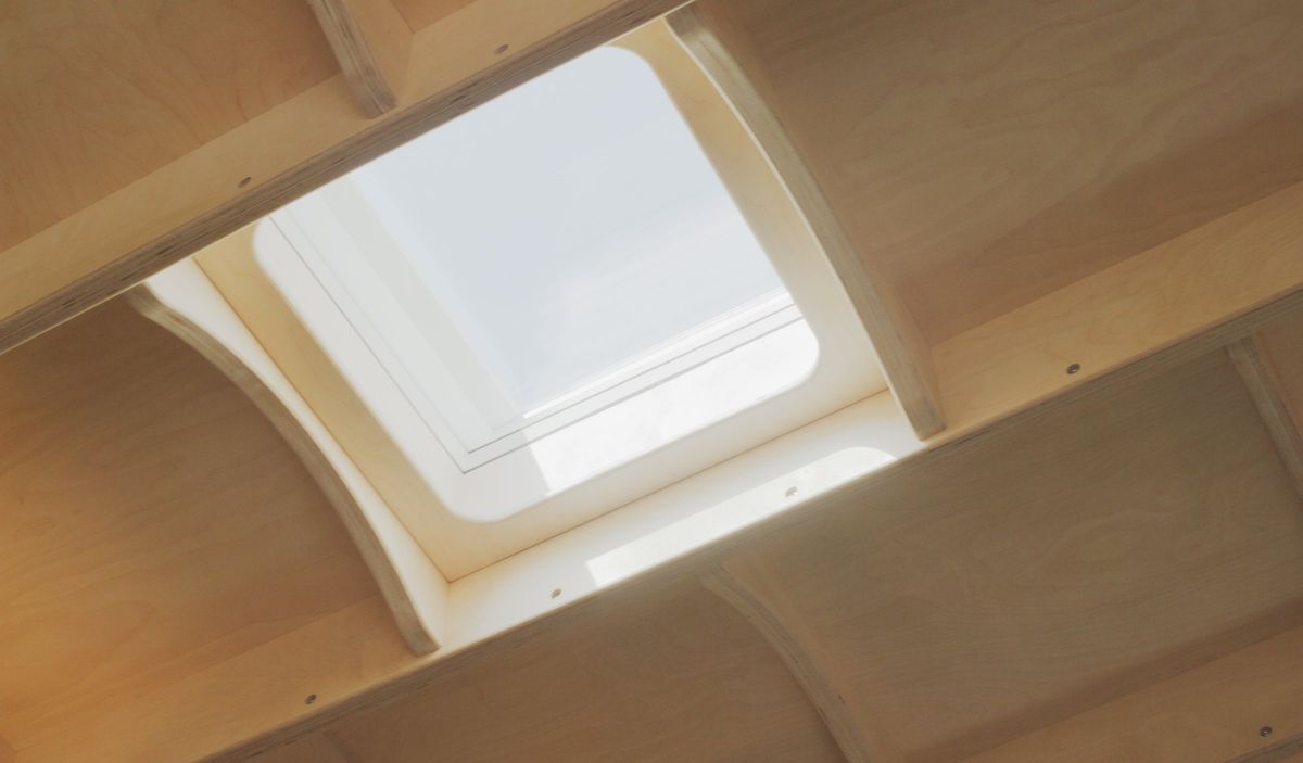 Skylight framed by curved plywood ribs